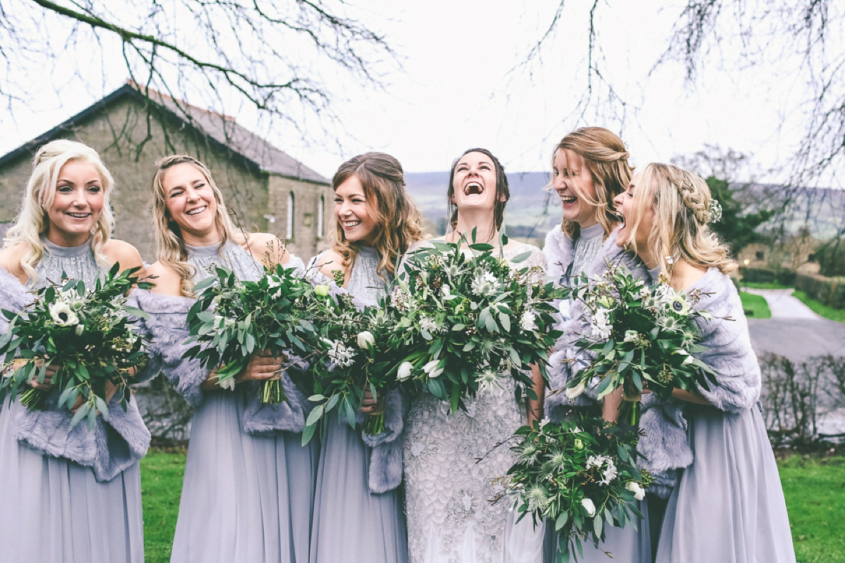 Jess wears an Eliza Jane Howell dress for her winter village hall wedding. Photography by Emma Boileau.