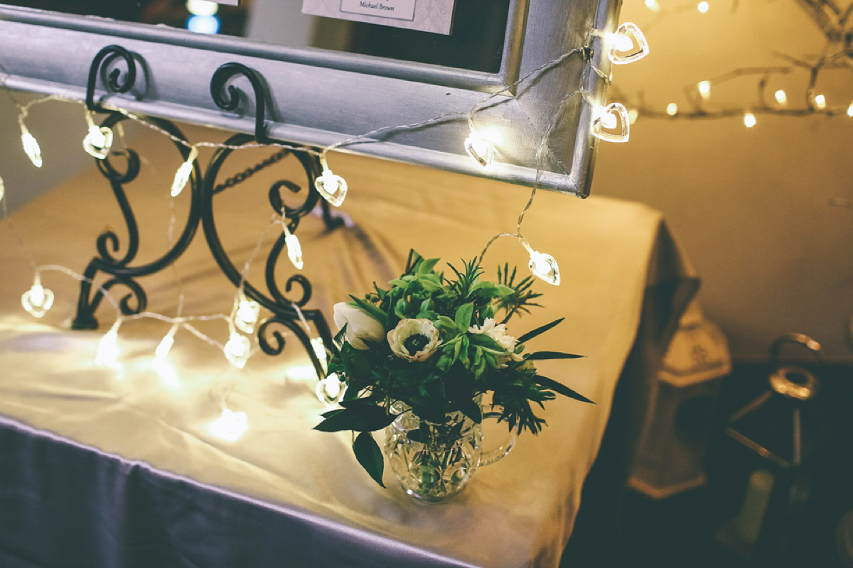 Jess wears an Eliza Jane Howell dress for her winter village hall wedding. Photography by Emma Boileau.