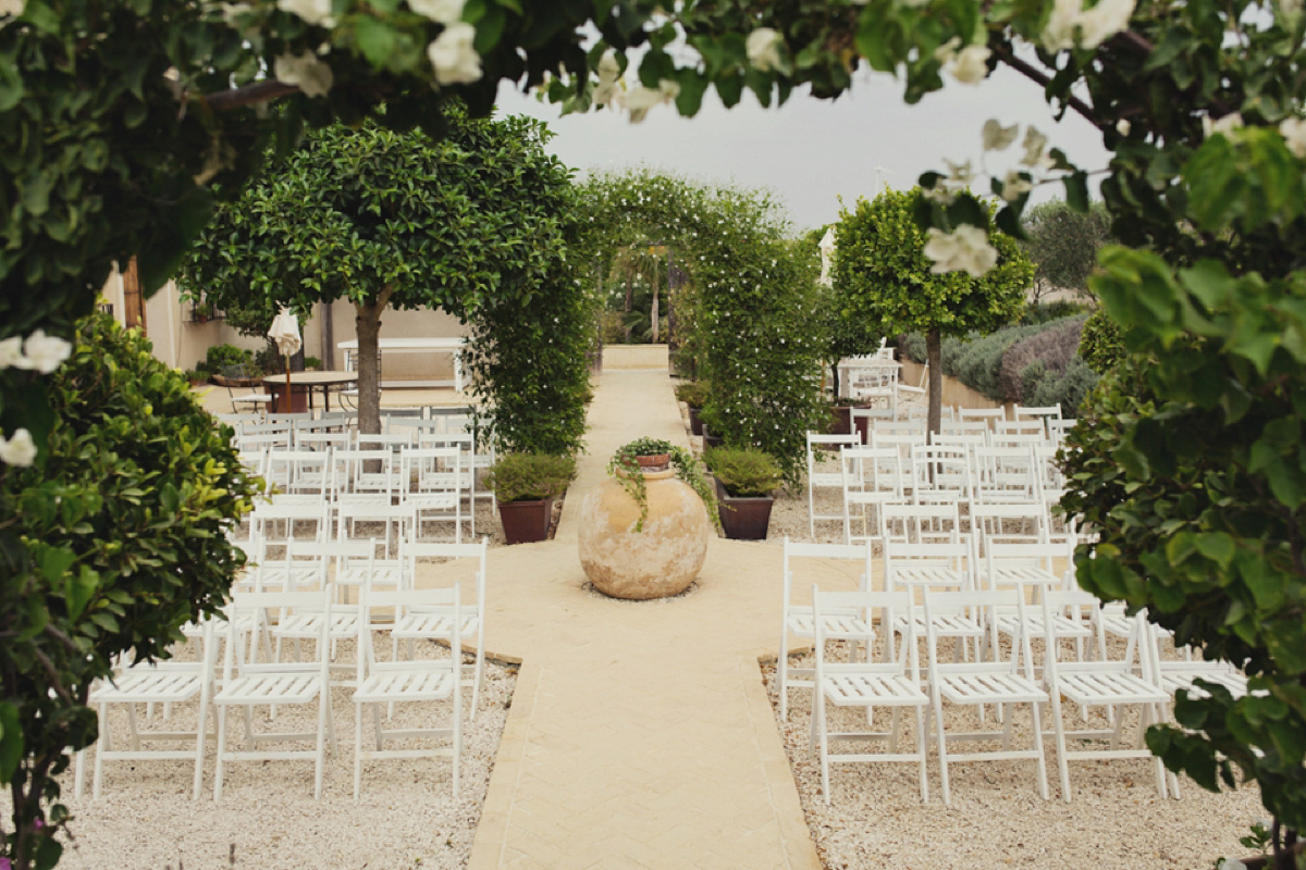 The bride wore Nicole by Jenny Packham for her intimate and relaxed wedding in Spain. Photography by Lisa Jane.