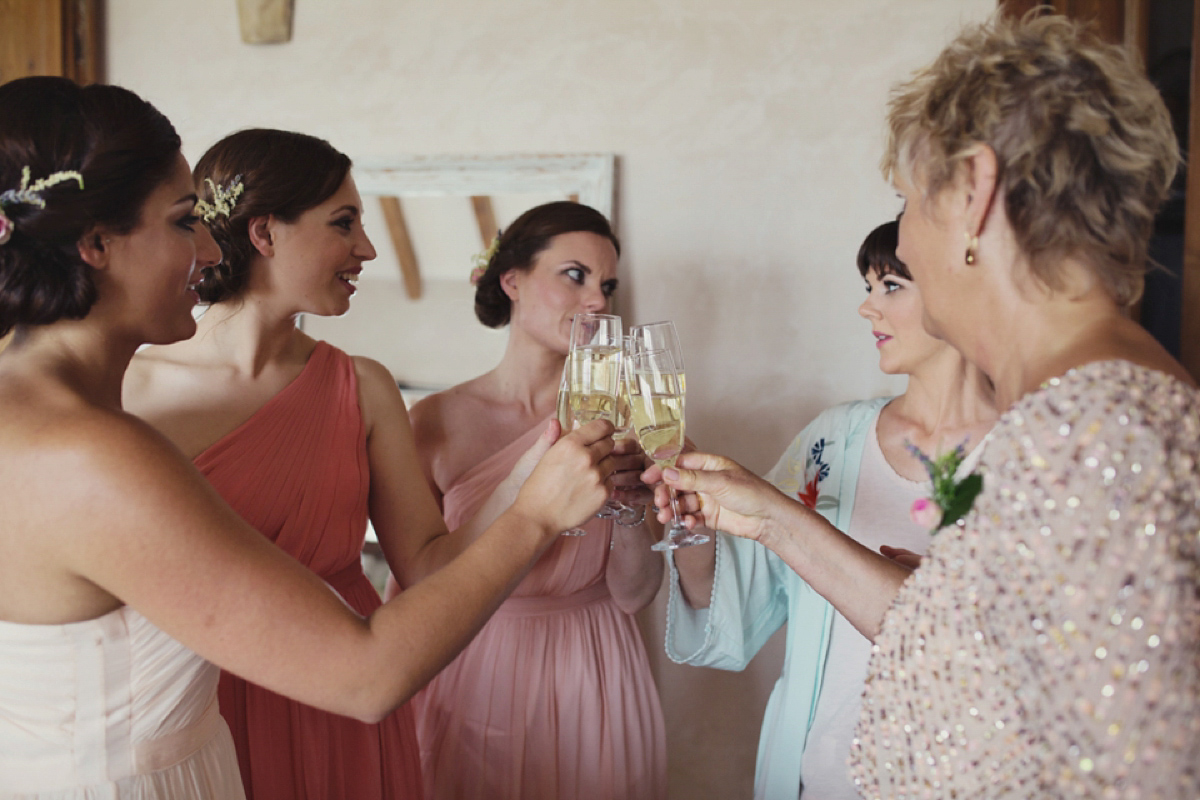 The bride wore Nicole by Jenny Packham for her intimate and relaxed wedding in Spain. Photography by Lisa Jane.