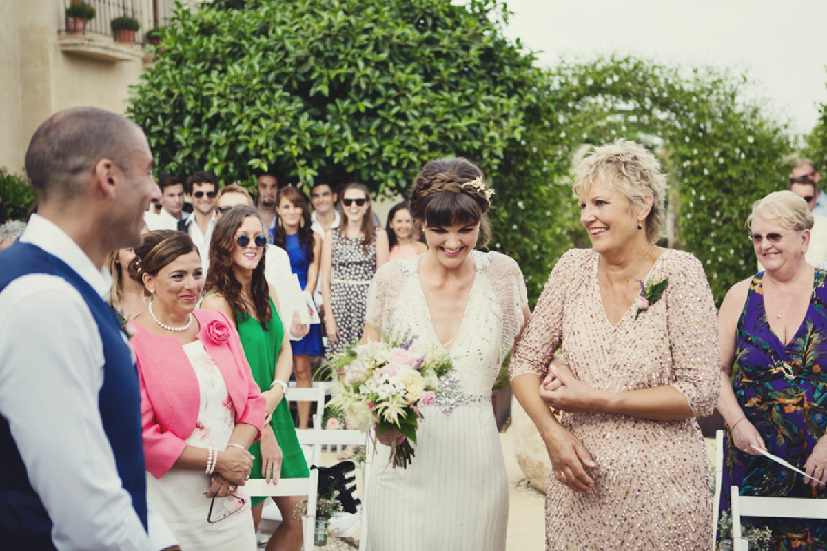 The bride wore Nicole by Jenny Packham for her intimate and relaxed wedding in Spain. Photography by Lisa Jane.