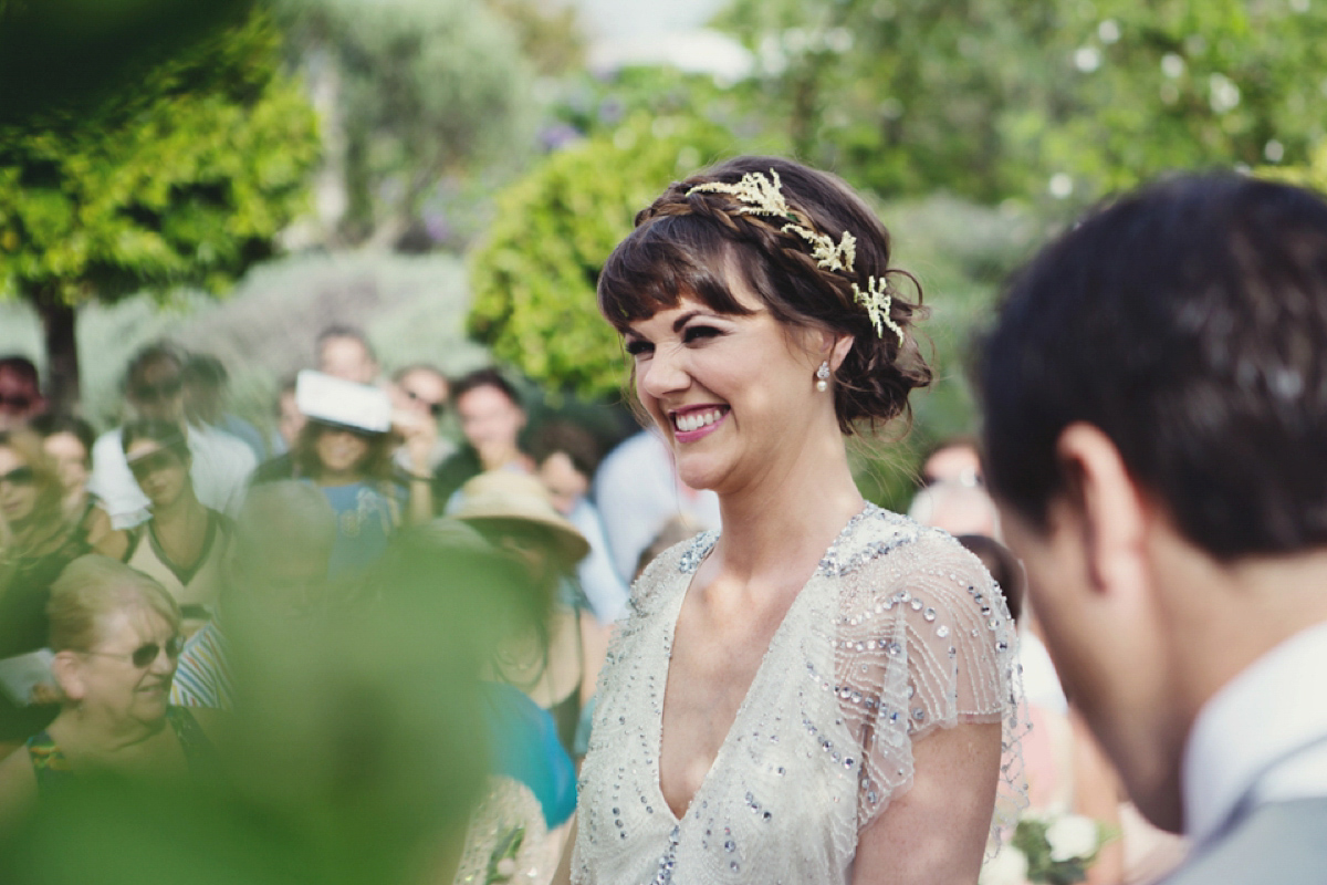 The bride wore Nicole by Jenny Packham for her intimate and relaxed wedding in Spain. Photography by Lisa Jane.