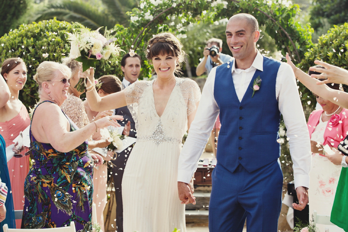 The bride wore Nicole by Jenny Packham for her intimate and relaxed wedding in Spain. Photography by Lisa Jane.