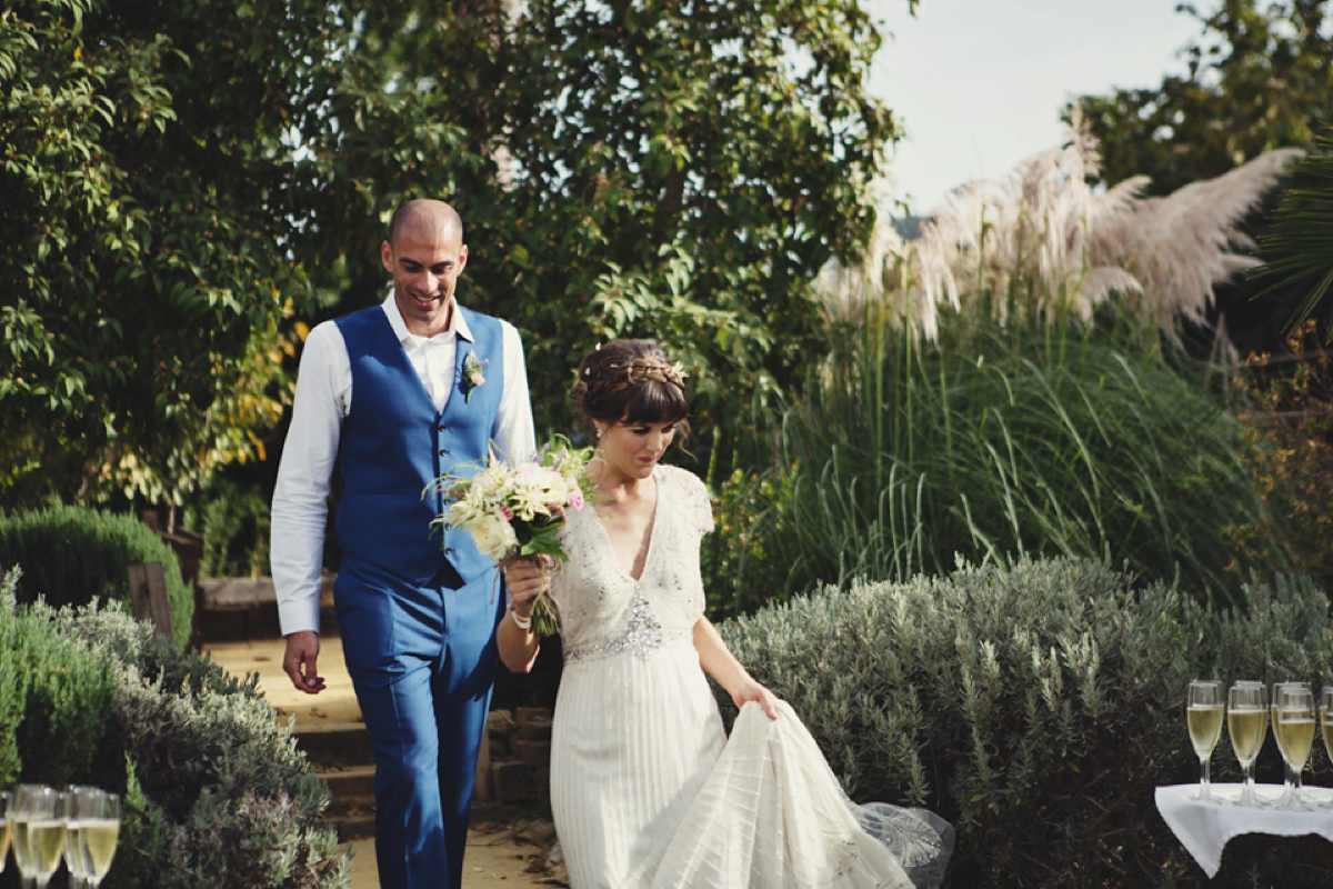 The bride wore Nicole by Jenny Packham for her intimate and relaxed wedding in Spain. Photography by Lisa Jane.