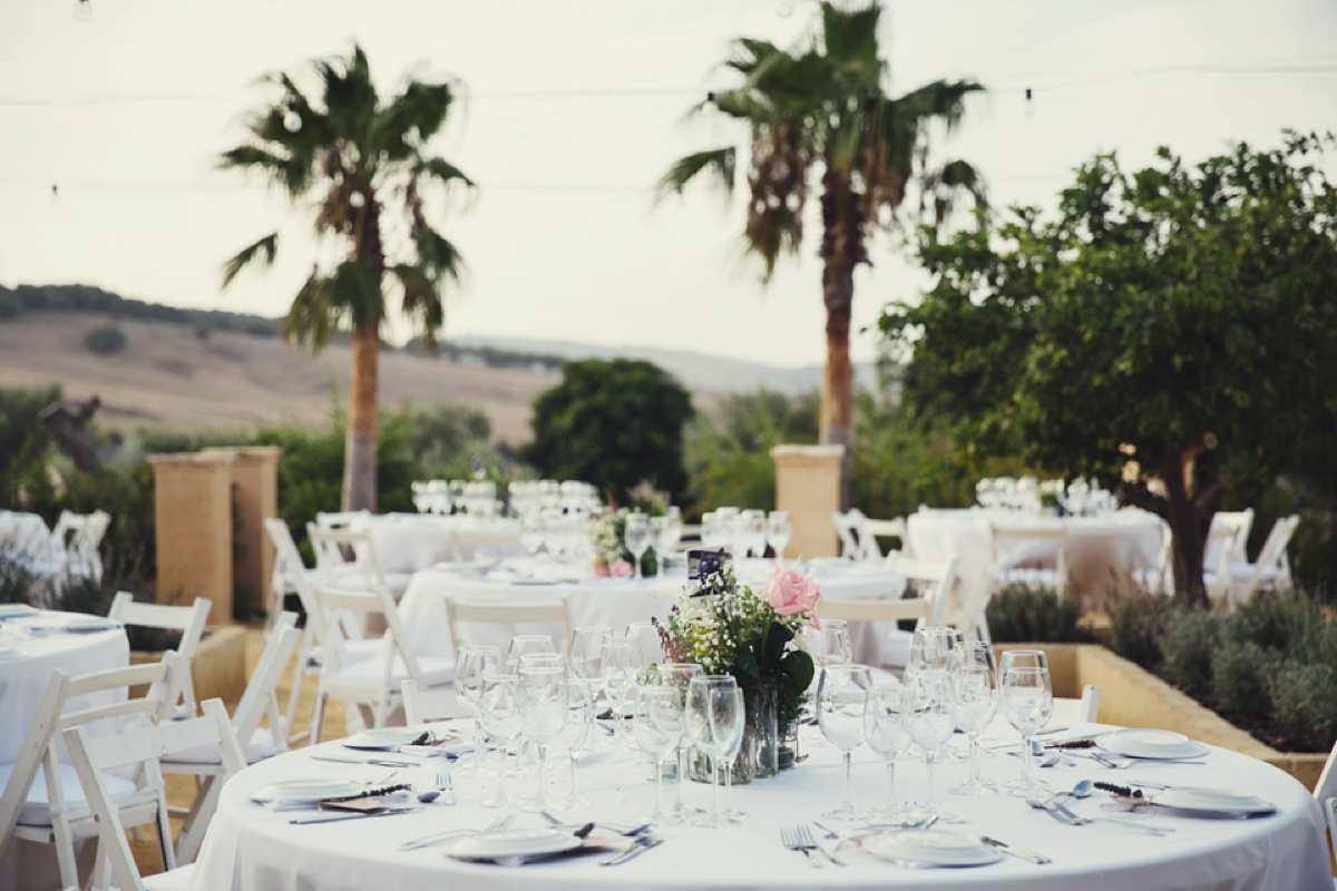 The bride wore Nicole by Jenny Packham for her intimate and relaxed wedding in Spain. Photography by Lisa Jane.