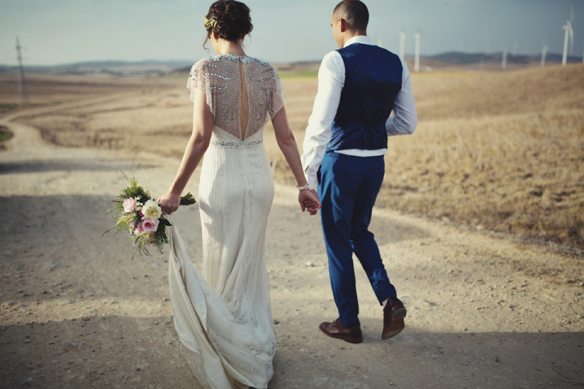 The bride wore Nicole by Jenny Packham for her intimate and relaxed wedding in Spain. Photography by Lisa Jane.