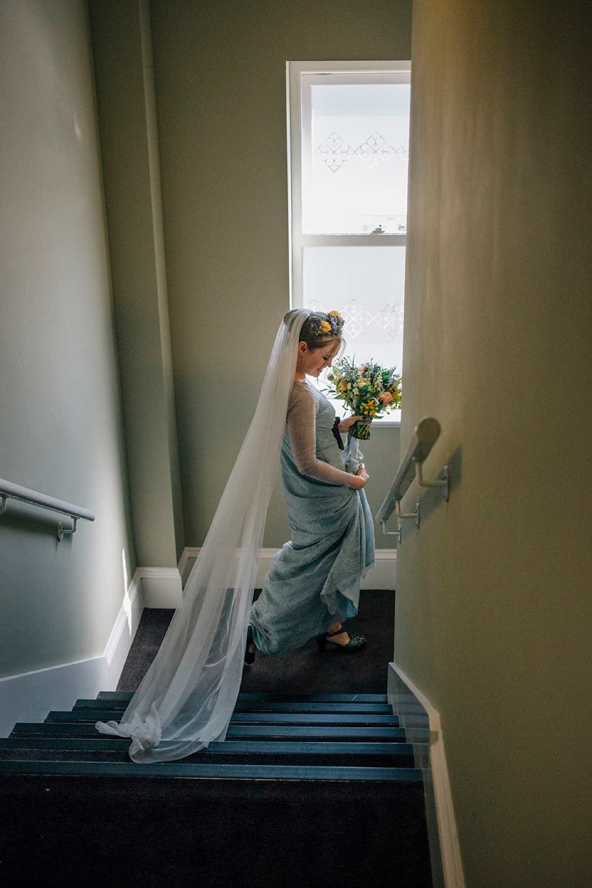 A pale green dress and first look for a feminist wedding in Yorkshire. Dress by Kate Beaumont, images by Kindred Photography.