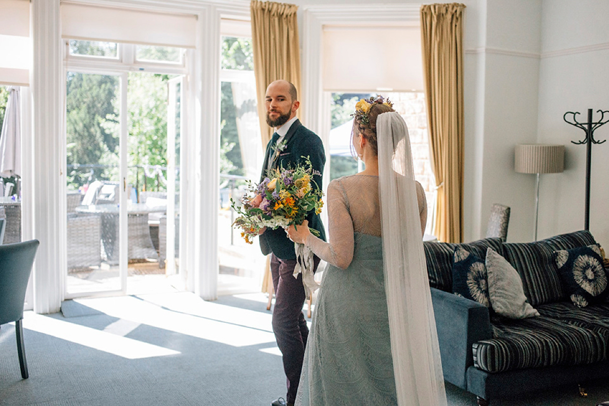 A pale green dress and first look for a feminist wedding in Yorkshire. Dress by Kate Beaumont, images by Kindred Photography.