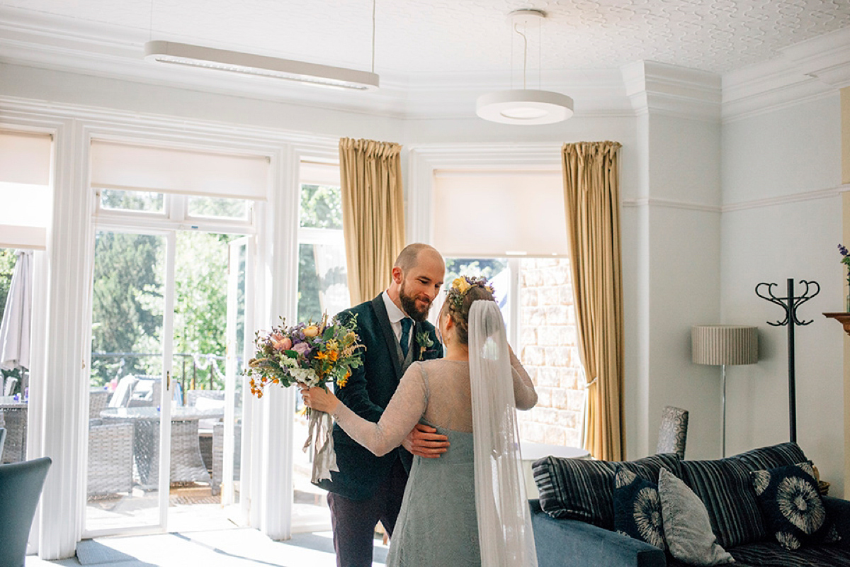 A pale green dress and first look for a feminist wedding in Yorkshire. Dress by Kate Beaumont, images by Kindred Photography.