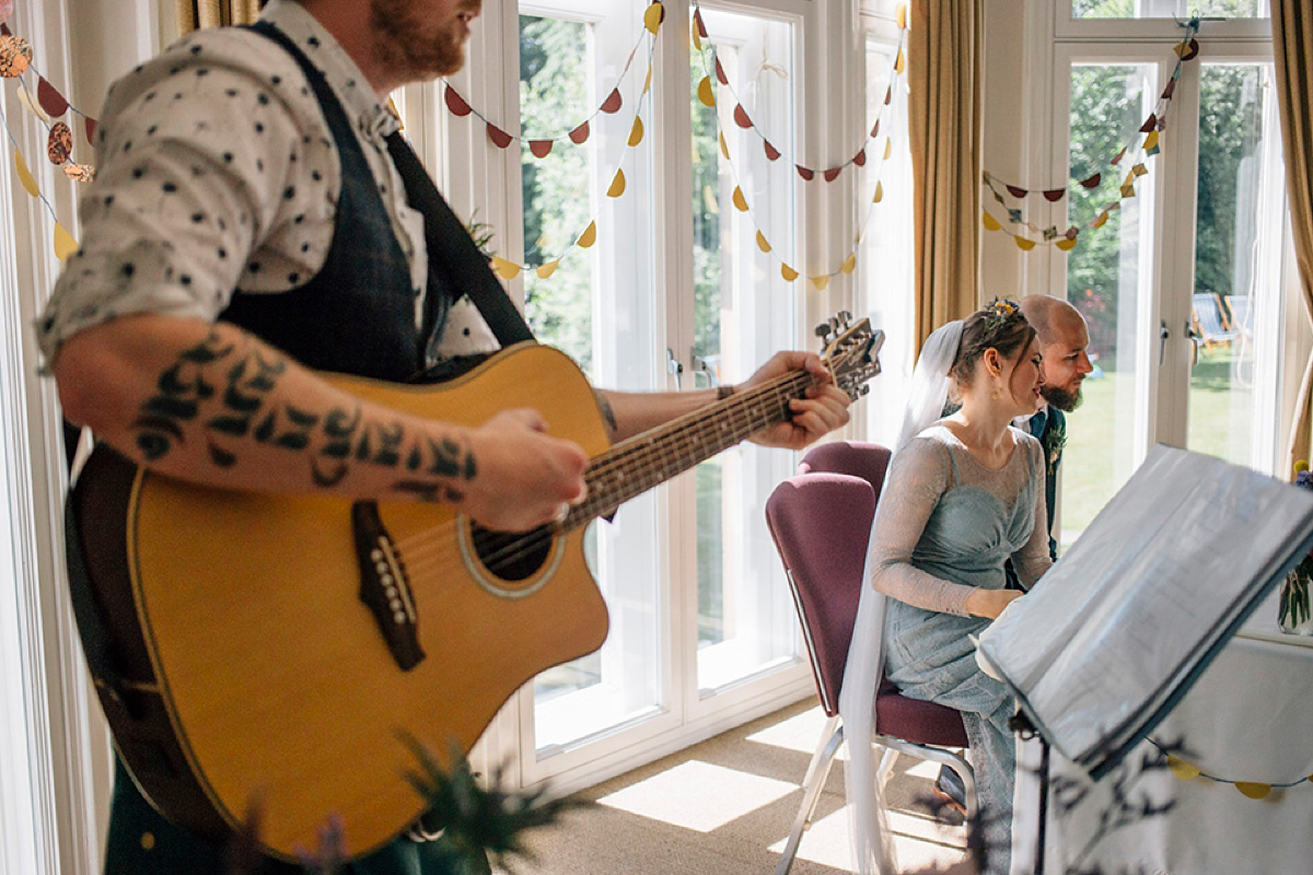 A pale green dress and first look for a feminist wedding in Yorkshire. Dress by Kate Beaumont, images by Kindred Photography.