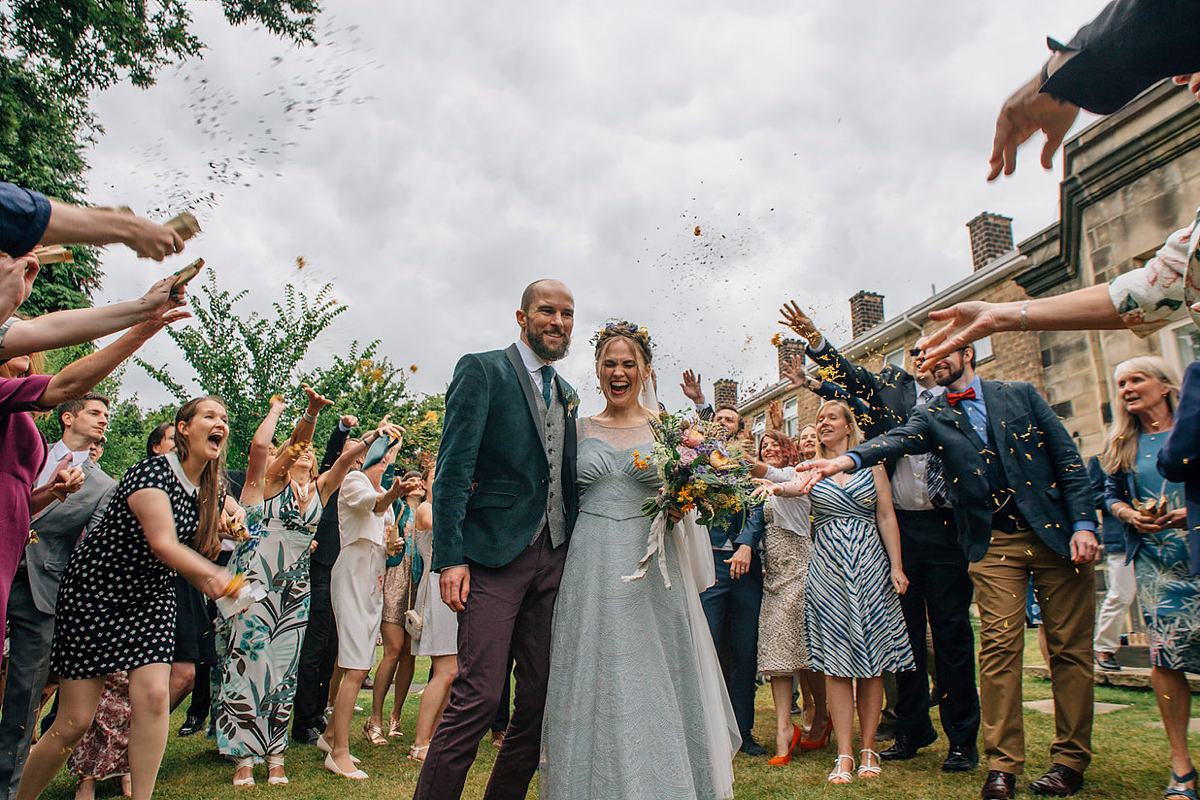 A pale green dress and first look for a feminist wedding in Yorkshire. Dress by Kate Beaumont, images by Kindred Photography.