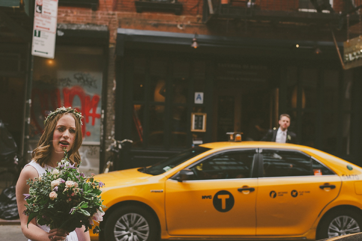 The bride wears a short dress she made herself for her intimate New York city wedding. Photography by Nabeel Khan.