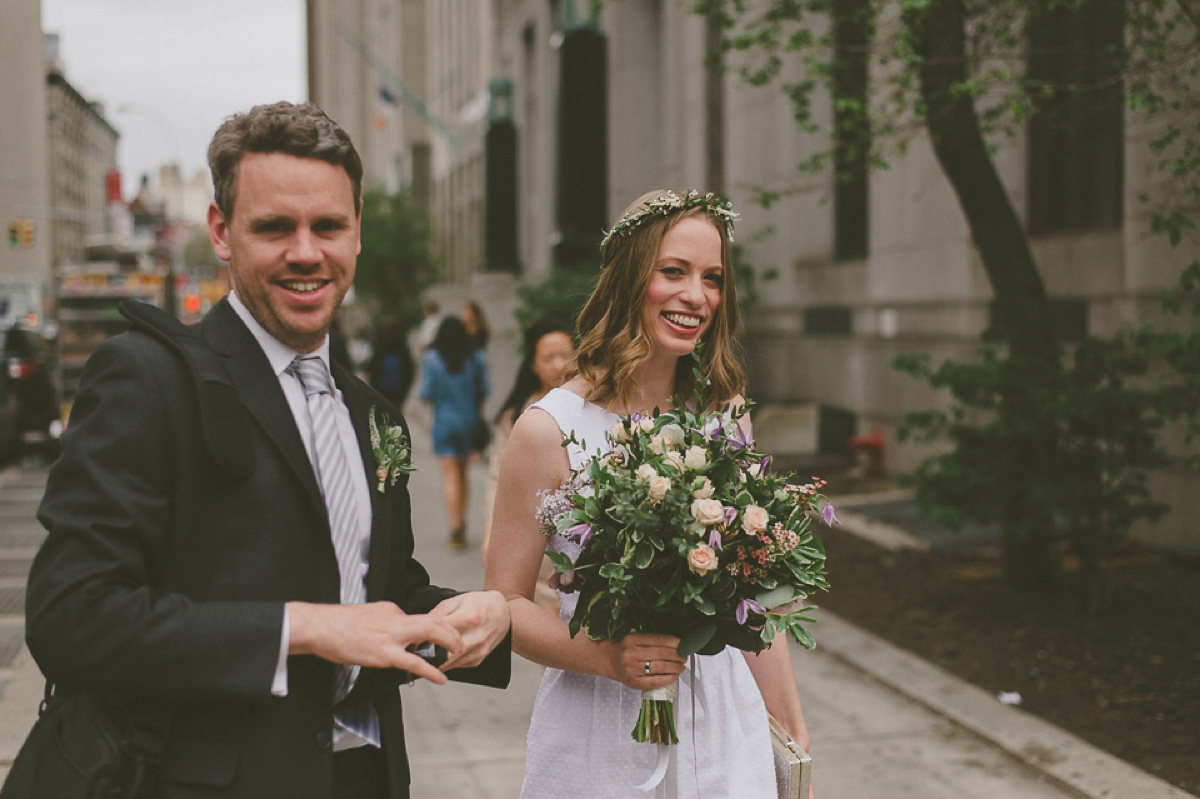 The bride wears a short dress she made herself for her intimate New York city wedding. Photography by Nabeel Khan.