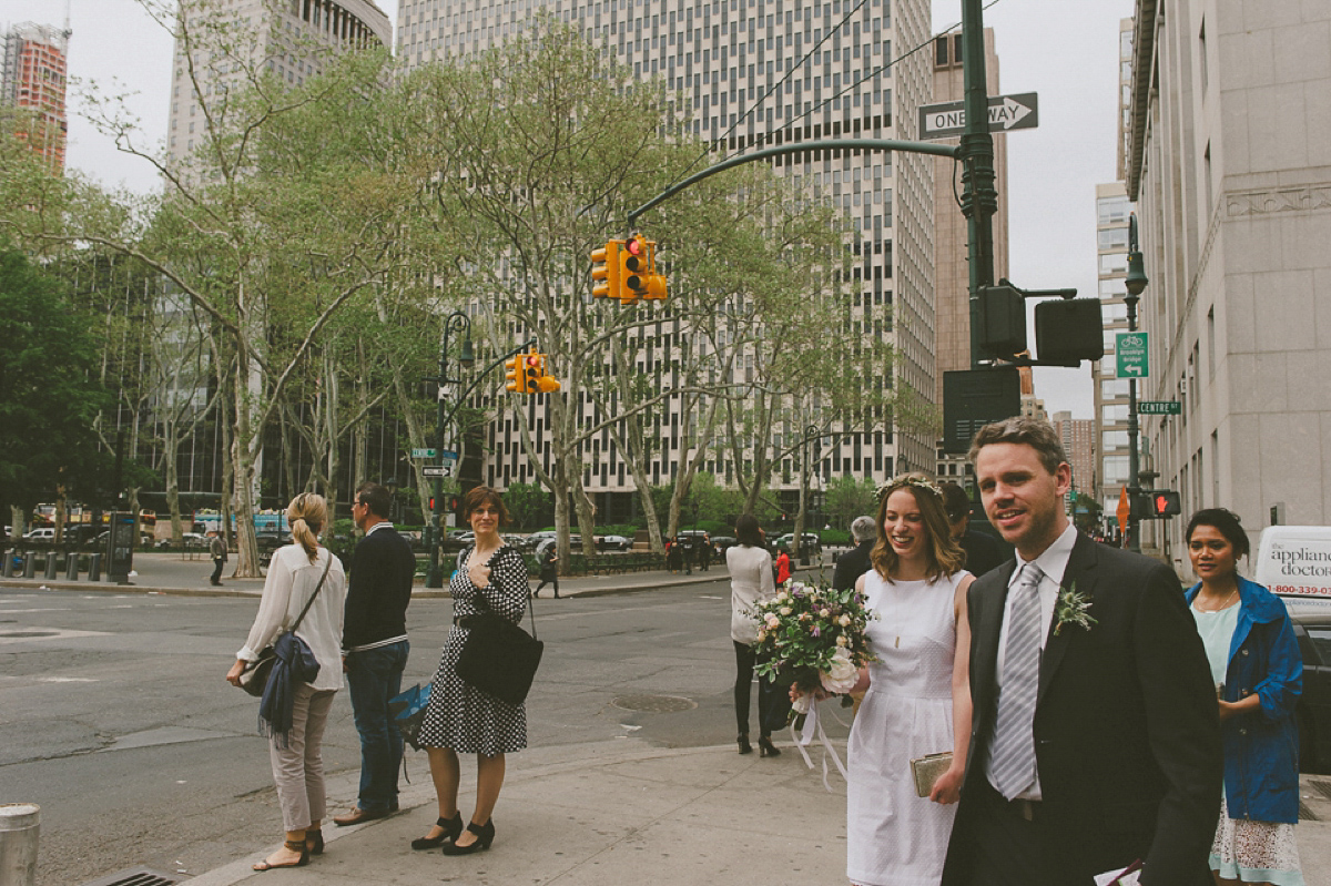 The bride wears a short dress she made herself for her intimate New York city wedding. Photography by Nabeel Khan.