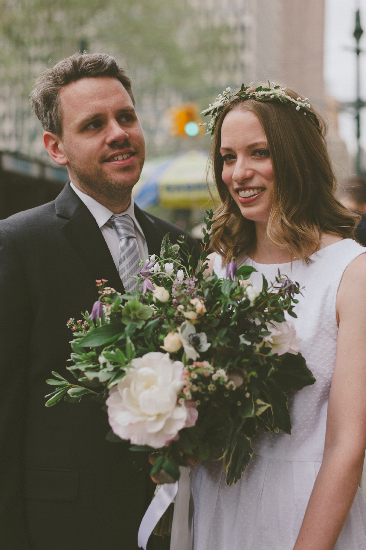 The bride wears a short dress she made herself for her intimate New York city wedding. Photography by Nabeel Khan.