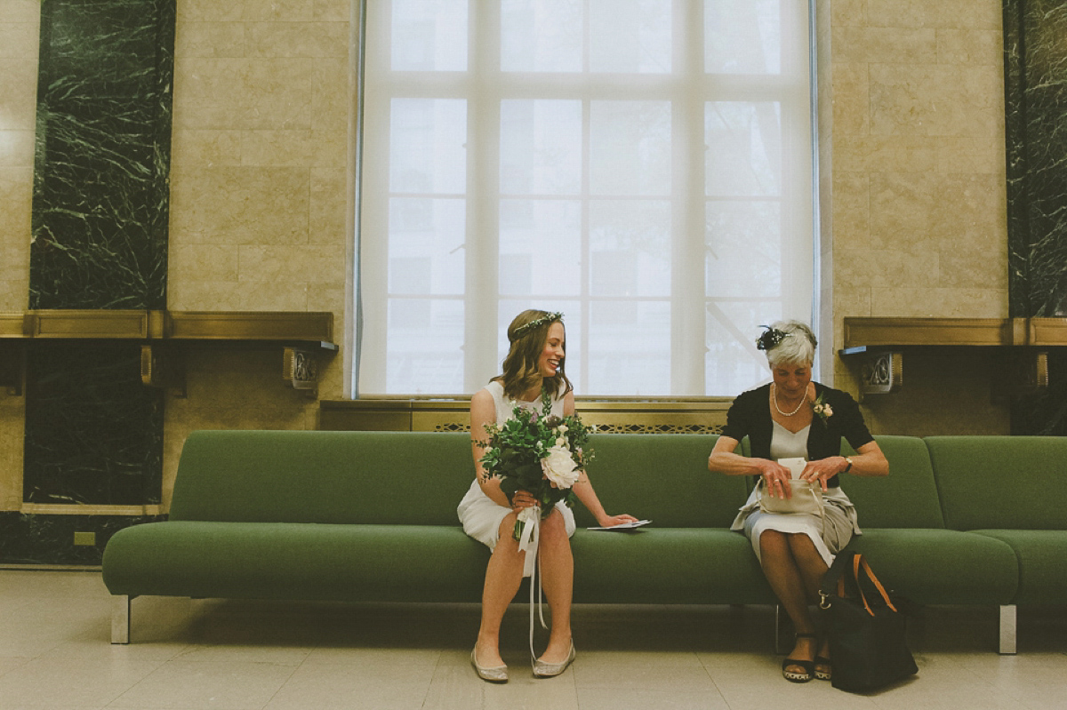 The bride wears a short dress she made herself for her intimate New York city wedding. Photography by Nabeel Khan.