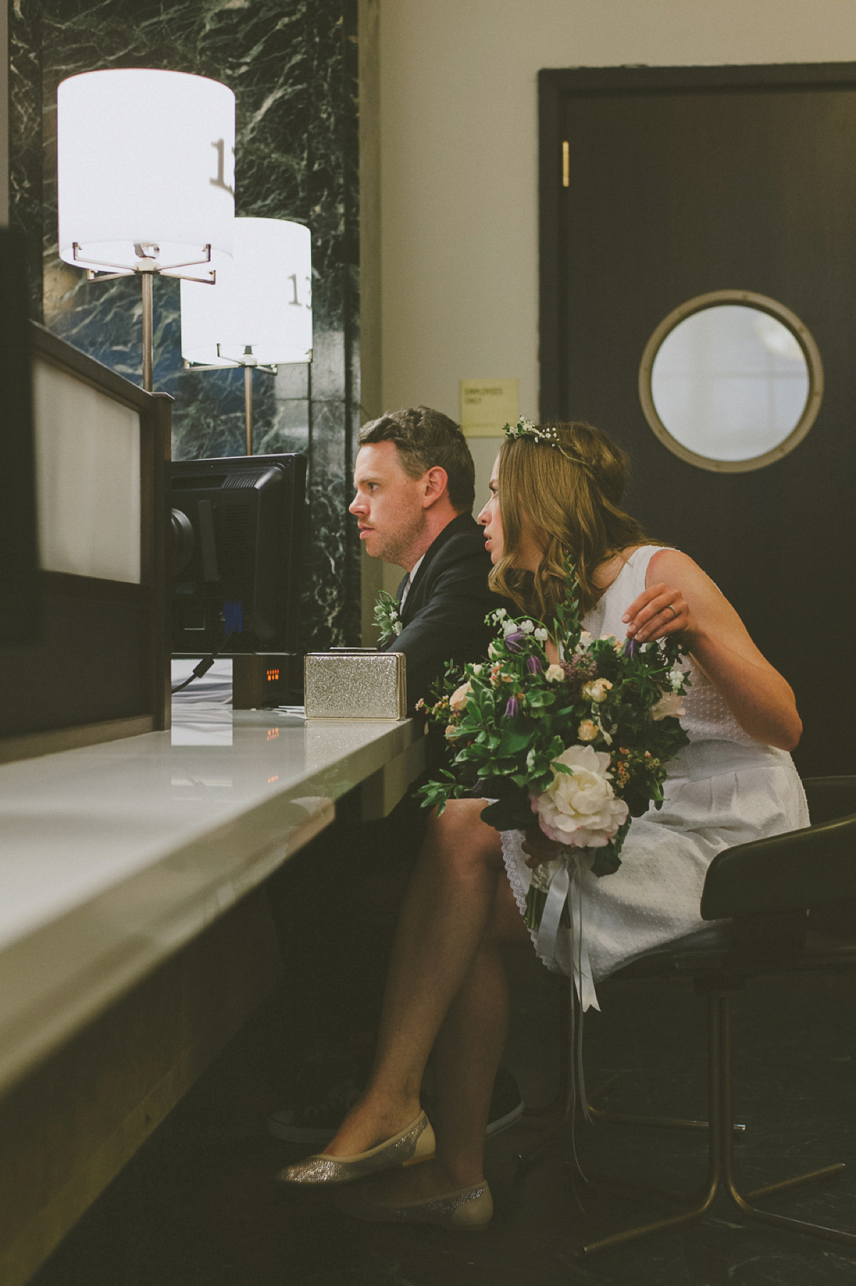 The bride wears a short dress she made herself for her intimate New York city wedding. Photography by Nabeel Khan.