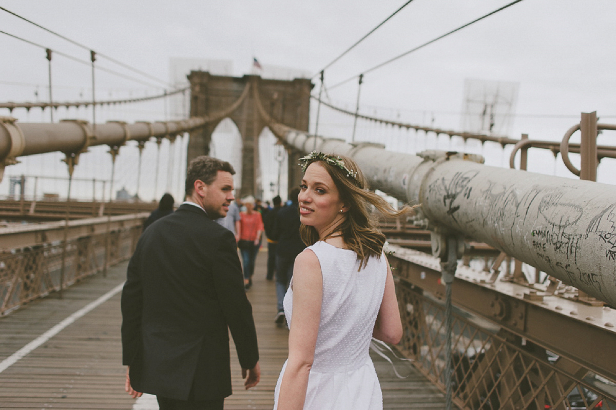 The bride wears a short dress she made herself for her intimate New York city wedding. Photography by Nabeel Khan.