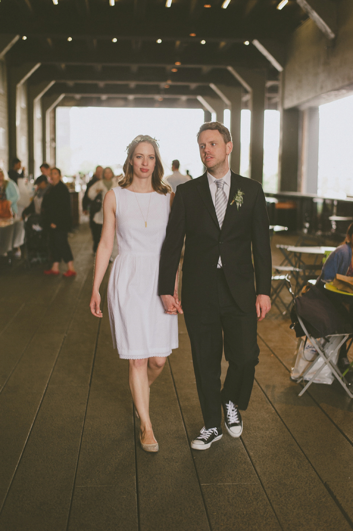 The bride wears a short dress she made herself for her intimate New York city wedding. Photography by Nabeel Khan.