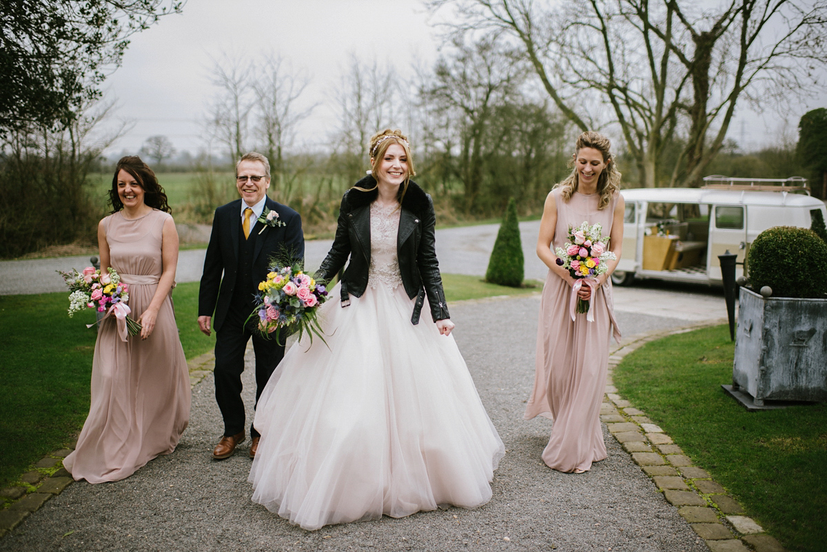 Jade wore a leather jacket with her Allure Bridals gown. Photography by Ed Godden.