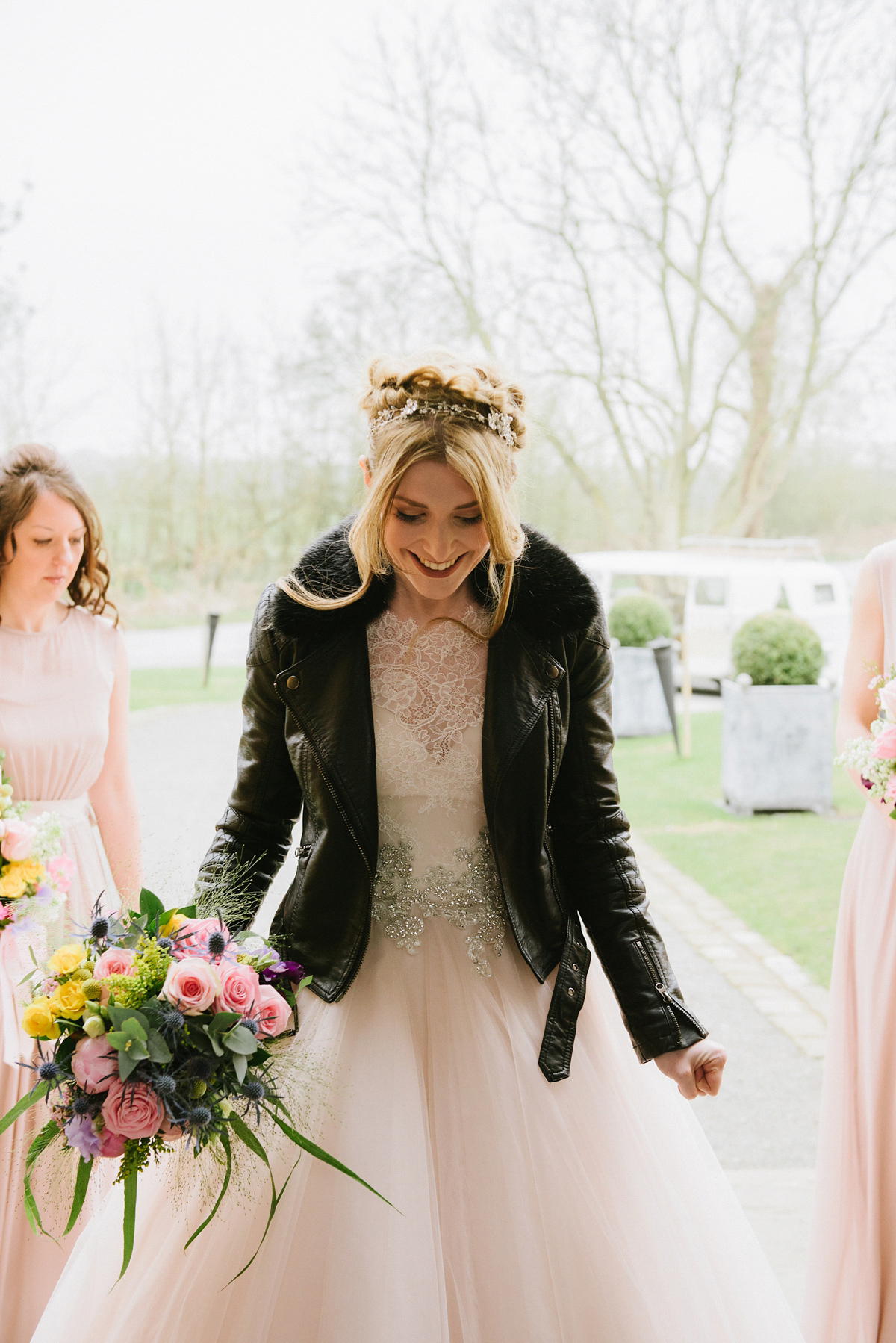 Jade wore a leather jacket with her Allure Bridals gown. Photography by Ed Godden.