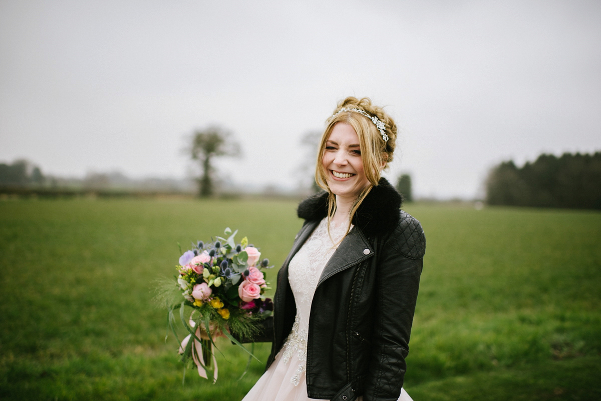 Jade wore a leather jacket with her Allure Bridals gown. Photography by Ed Godden.