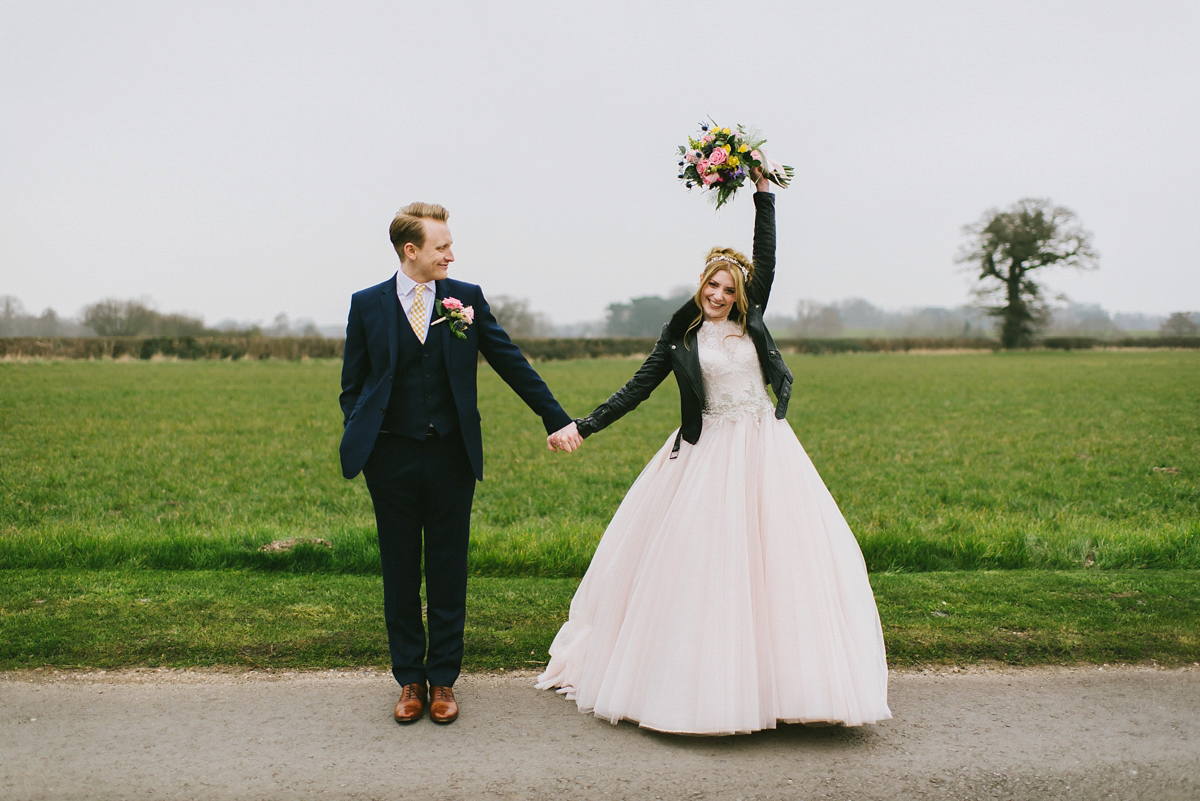 Jade wore a leather jacket with her Allure Bridals gown. Photography by Ed Godden.