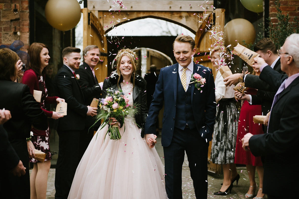 Jade wore a leather jacket with her Allure Bridals gown. Photography by Ed Godden.