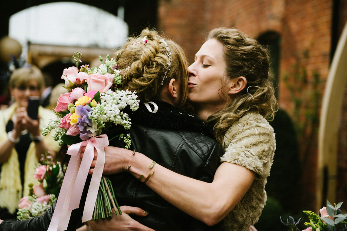 Jade wore a leather jacket with her Allure Bridals gown. Photography by Ed Godden.