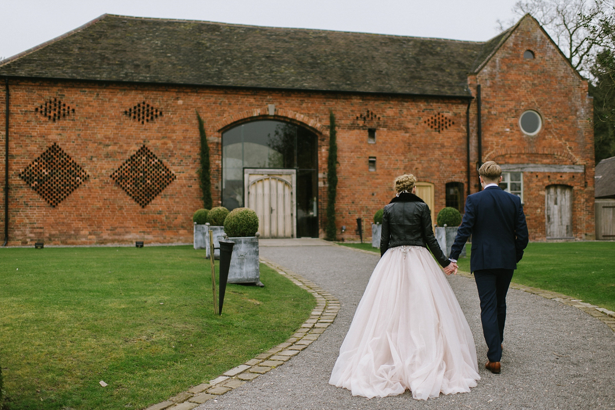 Jade wore a leather jacket with her Allure Bridals gown. Photography by Ed Godden.