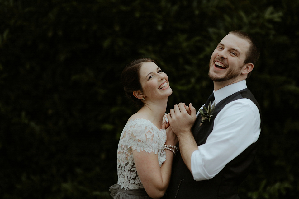 The bride wears a Jenny Yoo gown in soft grey tulle for her rustic Italian villa wedding. Photography by Cinzia Bruschini.