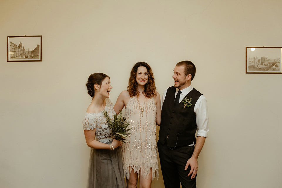 The bride wears a Jenny Yoo gown in soft grey tulle for her rustic Italian villa wedding. Photography by Cinzia Bruschini.