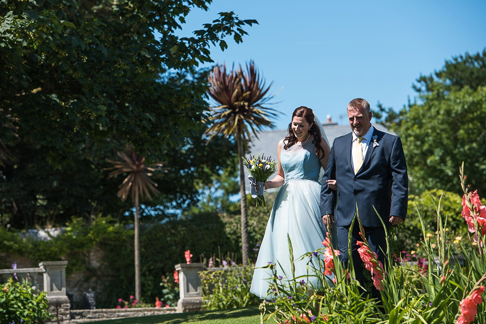 A pretty pale blue wedding dress for a nautical inspired Summer wedding by the sea. Photography by Alexandria Hall.