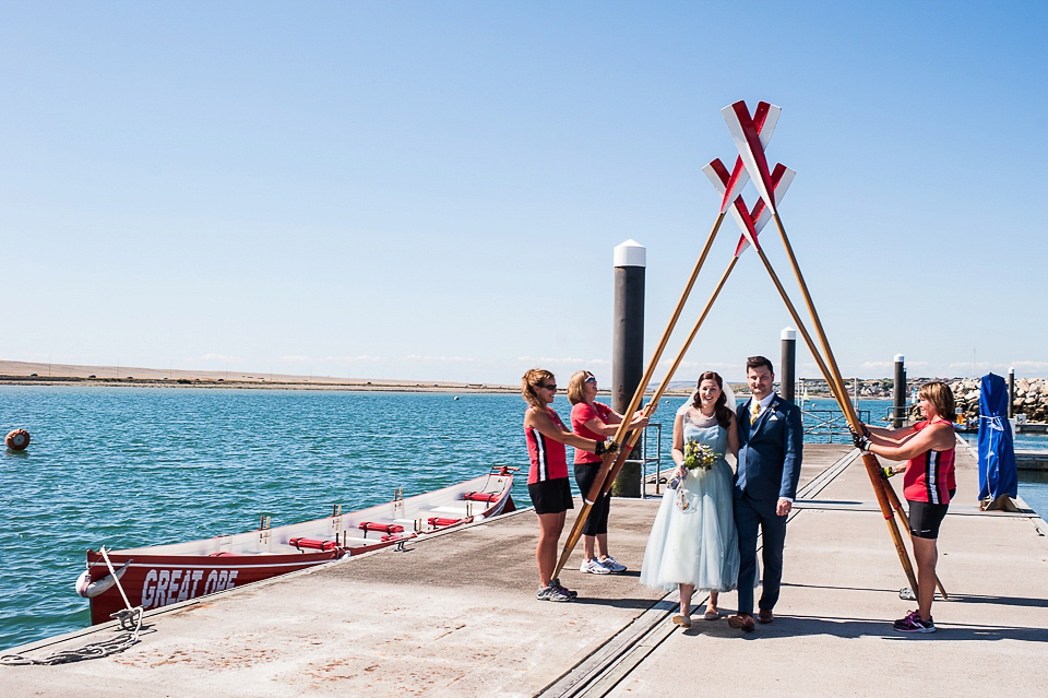 A pretty pale blue wedding dress for a nautical inspired Summer wedding by the sea. Photography by Alexandria Hall.