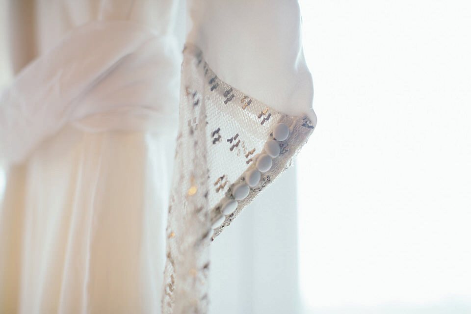 A tweed jacket and feathers in her hair for a boho bride and her eclectic woodland wedding. Images by Mirrorbox Photography.