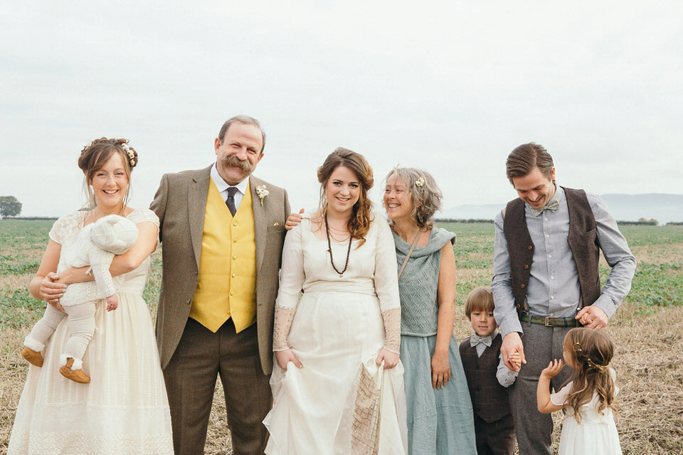 A tweed jacket and feathers in her hair for a boho bride and her eclectic woodland wedding. Images by Mirrorbox Photography.