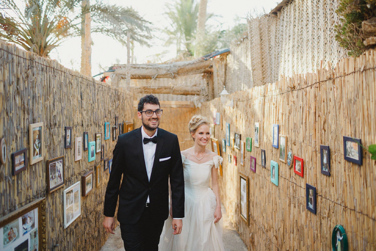 Bride Noga wore a vintage wedding dress for her modern festival wedding in the desert. Images by Echoes & Wildhearts Photography.