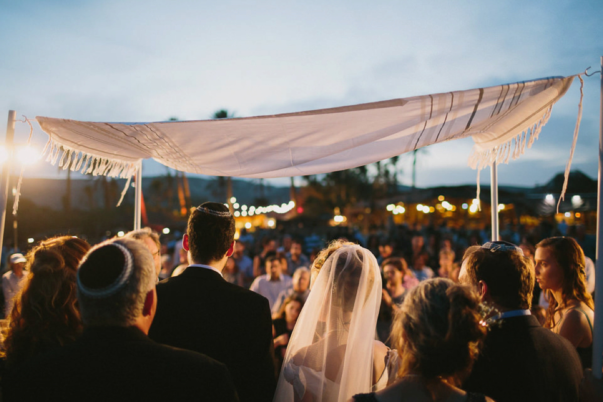 Bride Noga wore a vintage wedding dress for her modern festival wedding in the desert. Images by Echoes & Wildhearts Photography.