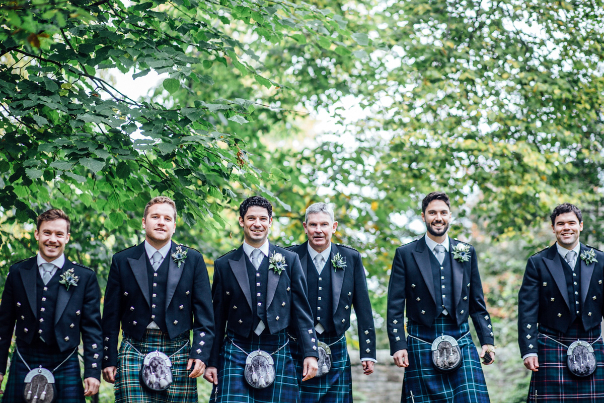 The bride wore a Catherine Deane gown for her Autumn wedding in Edinburgh. Photography by Carley Buick.