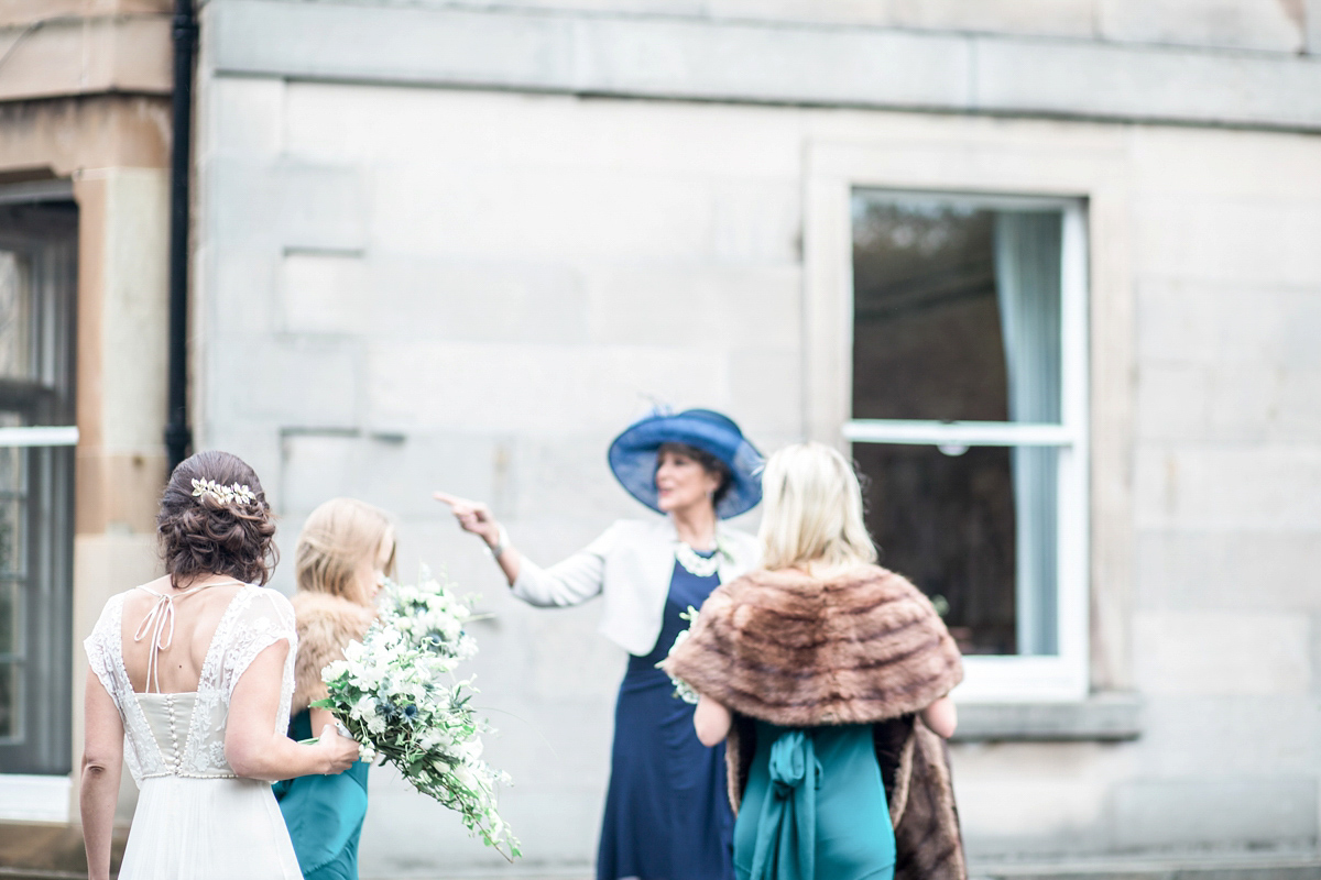 The bride wore a Catherine Deane gown for her Autumn wedding in Edinburgh. Photography by Carley Buick.