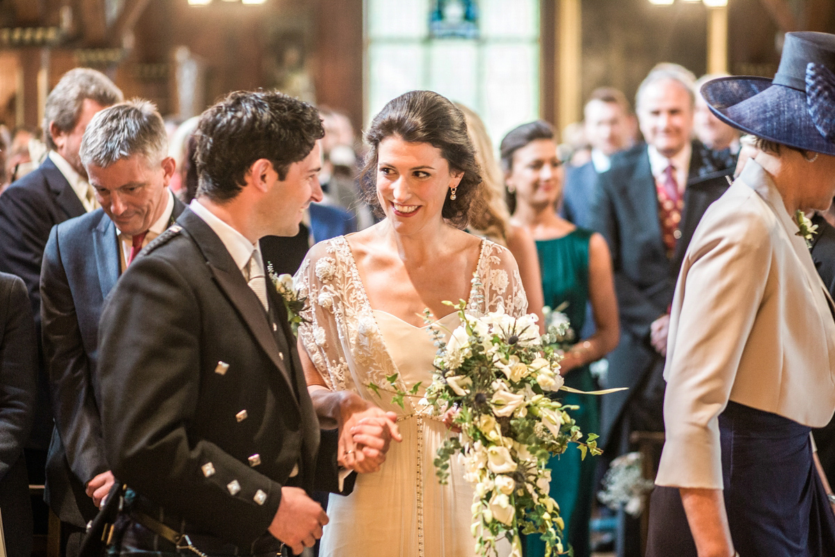 The bride wore a Catherine Deane gown for her Autumn wedding in Edinburgh. Photography by Carley Buick.