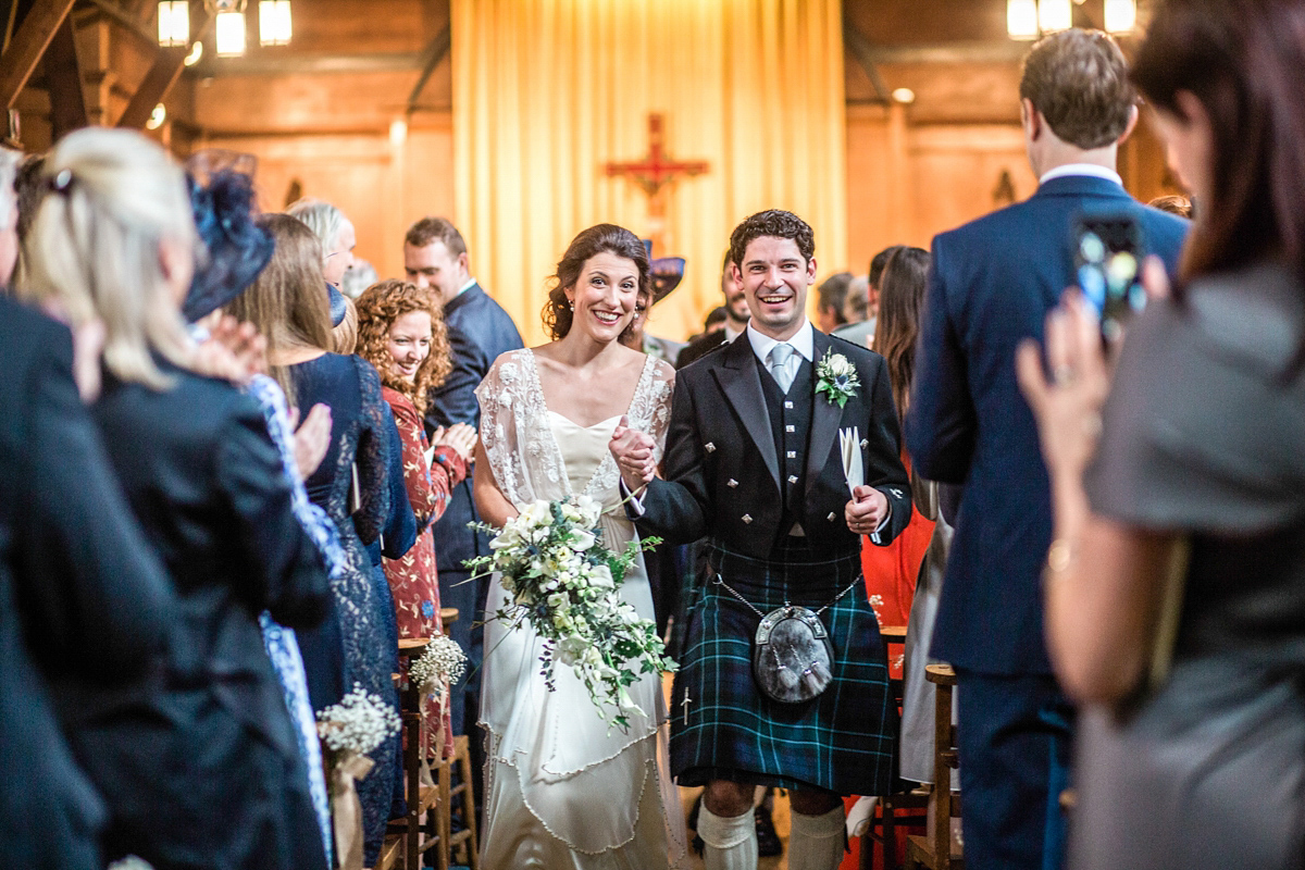 The bride wore a Catherine Deane gown for her Autumn wedding in Edinburgh. Photography by Carley Buick.