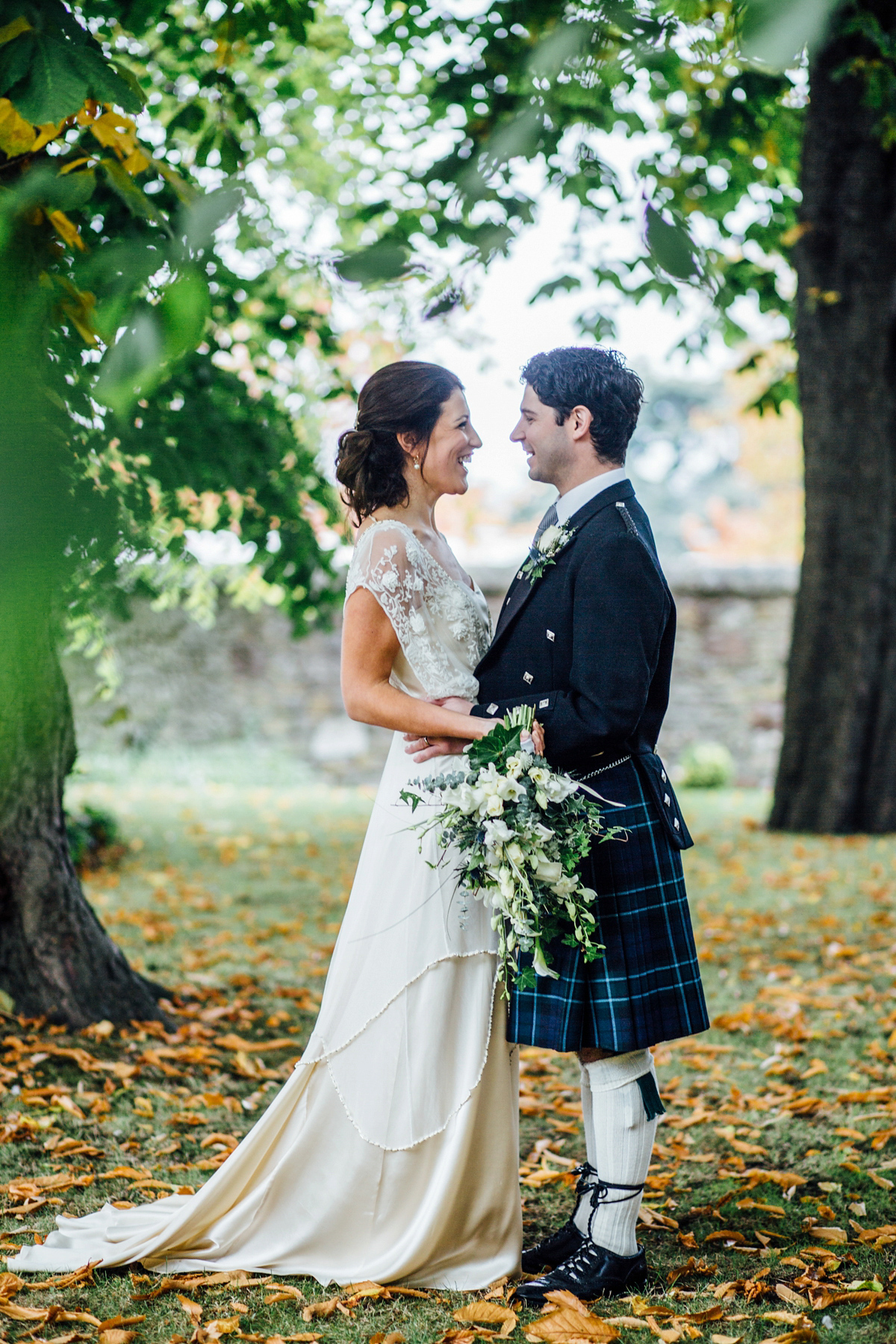 The bride wore a Catherine Deane gown for her Autumn wedding in Edinburgh. Photography by Carley Buick.