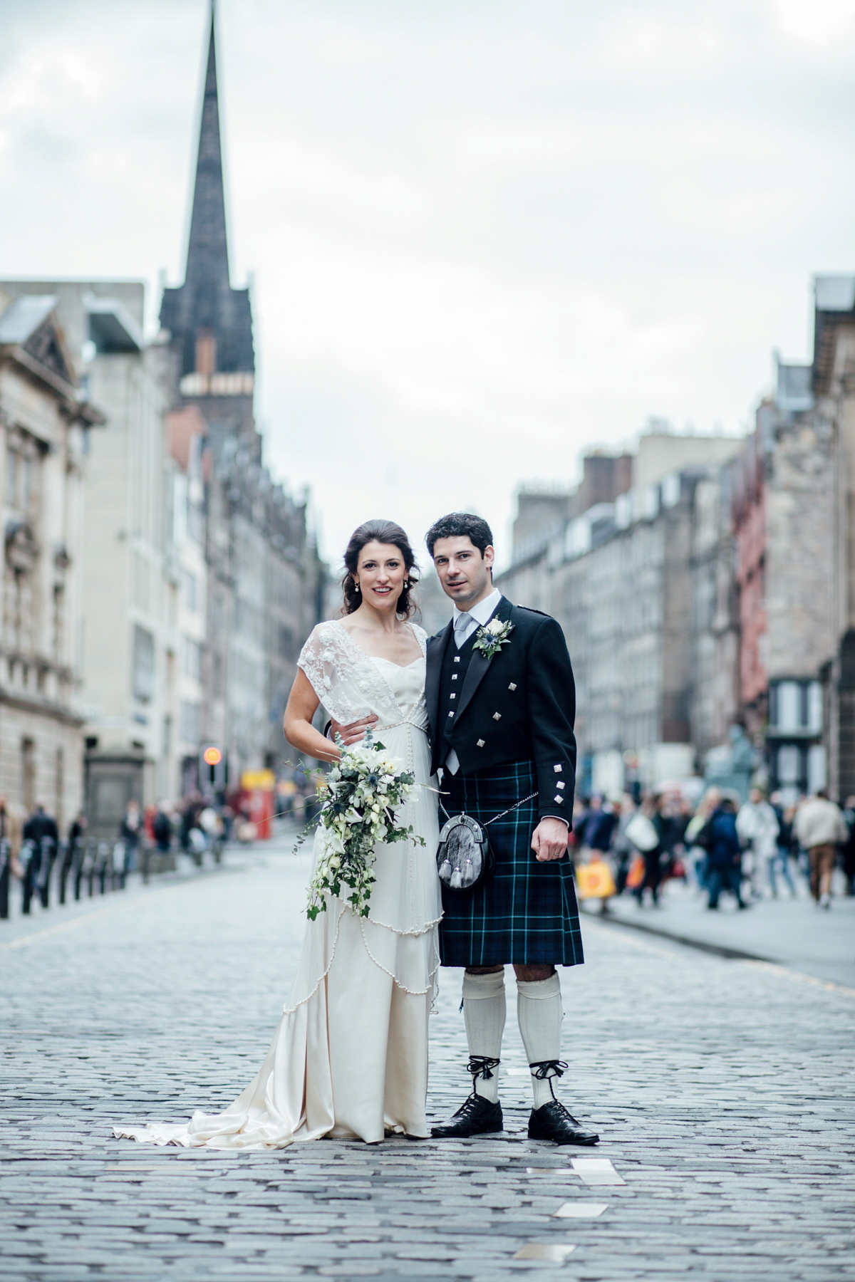 The bride wore a Catherine Deane gown for her Autumn wedding in Edinburgh. Photography by Carley Buick.