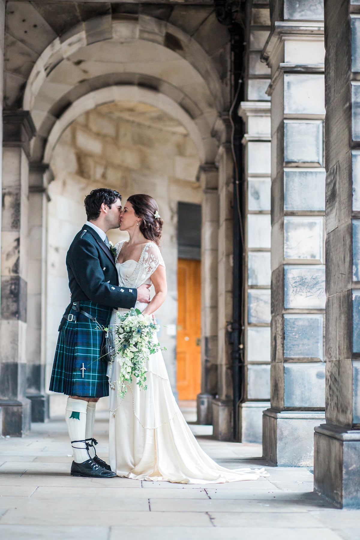 The bride wore a Catherine Deane gown for her Autumn wedding in Edinburgh. Photography by Carley Buick.