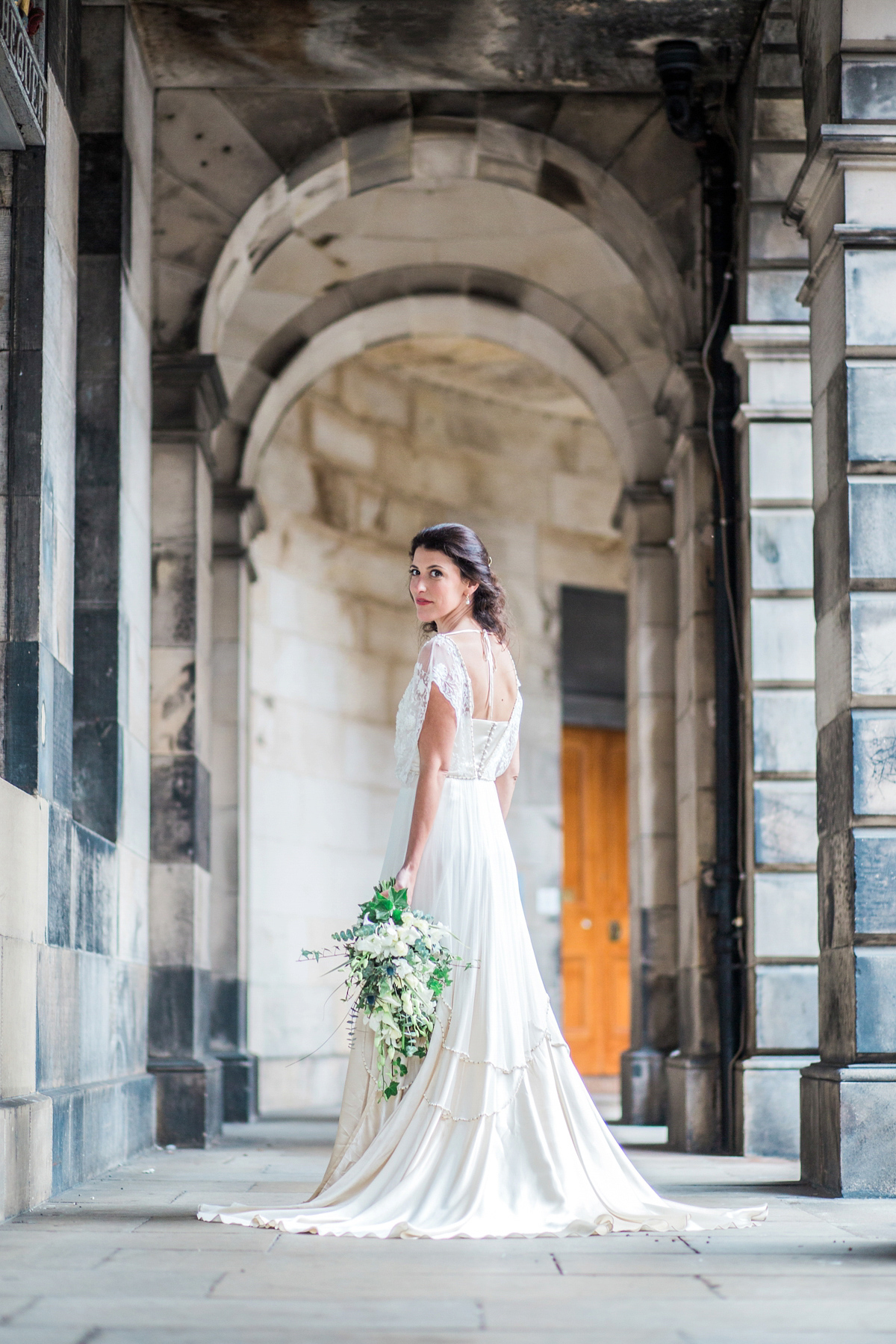 The bride wore a Catherine Deane gown for her Autumn wedding in Edinburgh. Photography by Carley Buick.