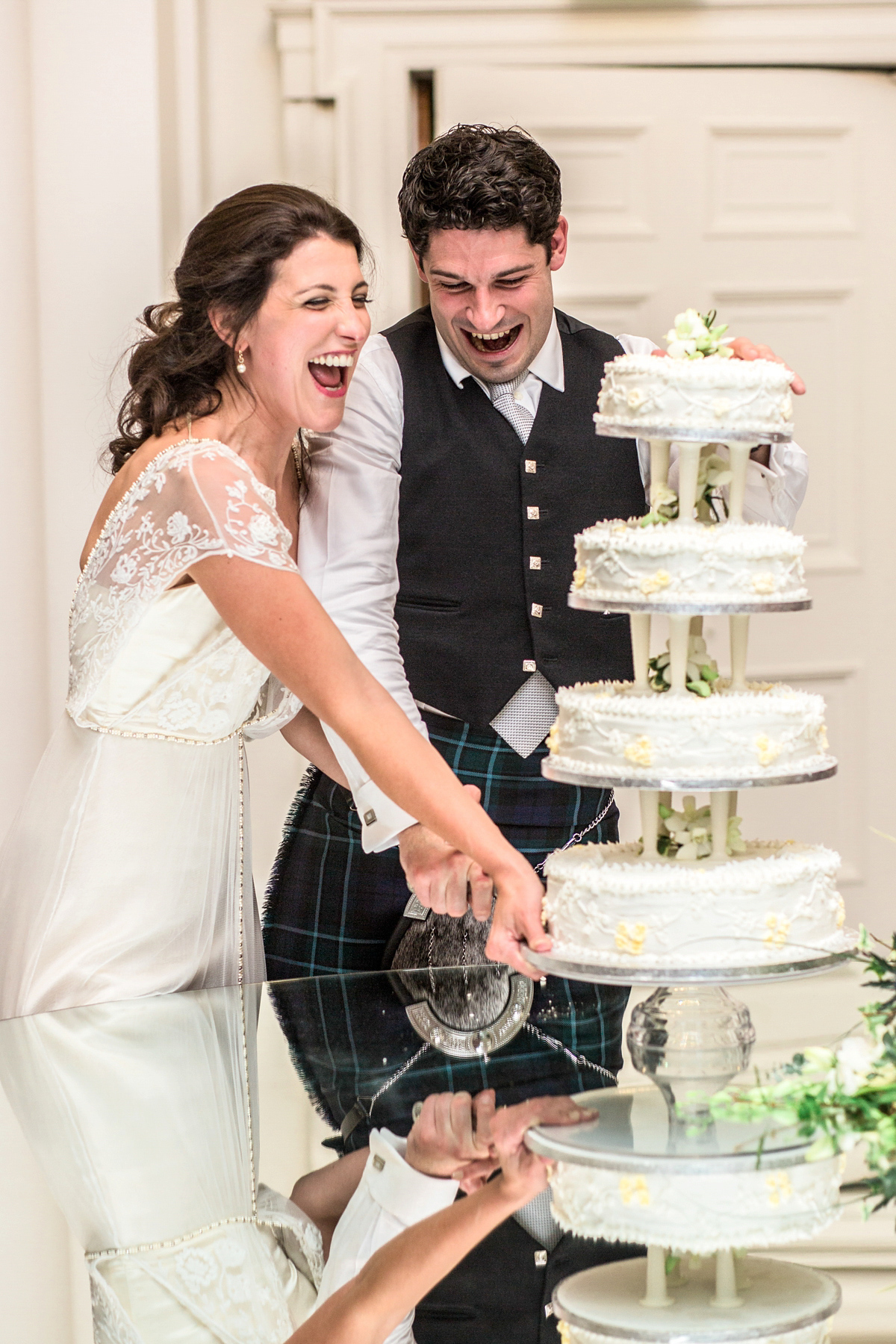 The bride wore a Catherine Deane gown for her Autumn wedding in Edinburgh. Photography by Carley Buick.