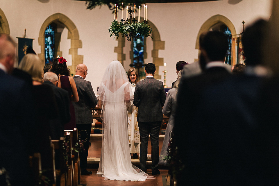 A Suzanne Neville gown for a 1940's Goodwood Vintage inspired winter wedding. Images by Eclection Photography.