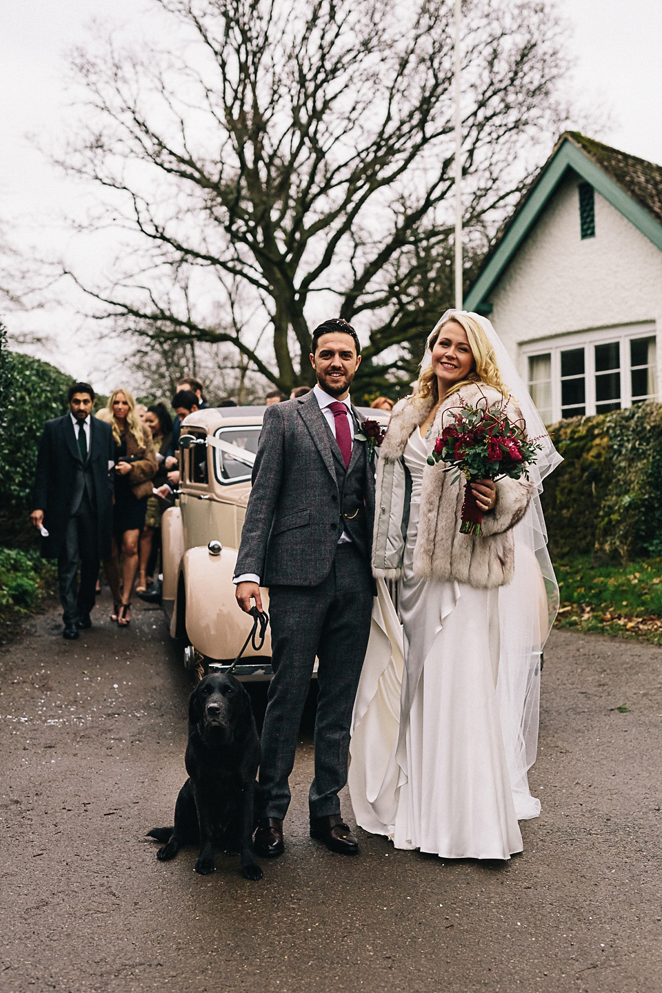 A Suzanne Neville gown for a 1940's Goodwood Vintage inspired winter wedding. Images by Eclection Photography.