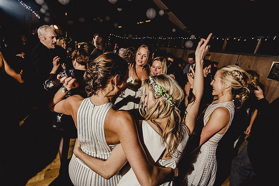 Bride Olivia wore a Charlie Brear gown for her Papakata teepee wedding on New Years Eve. The coupled tied the knot in the bride's mothers garden. Photography by Steve Rooney.